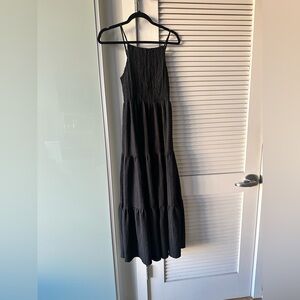 A smocked bodice shapes a flowy tiered maxi dress